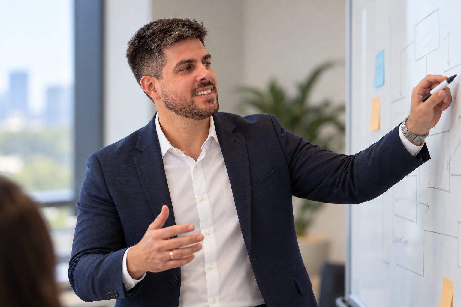 Pedro Monteiro explaining a process improvement at a whiteboard